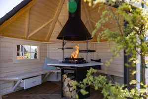 A lit Luxury grill showing the features of the the grill inside a BBQ Hut.