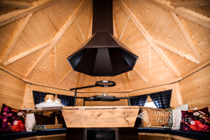 a close up shot taken at table height looking upwards towards the chimney of the BBQ grill.