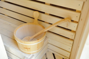 A top down shot of the bucket and ladle inside a plastic cover to increase the life of the product.