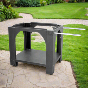 Black pizza oven stand in a modern garden on a sunny day sat on a path