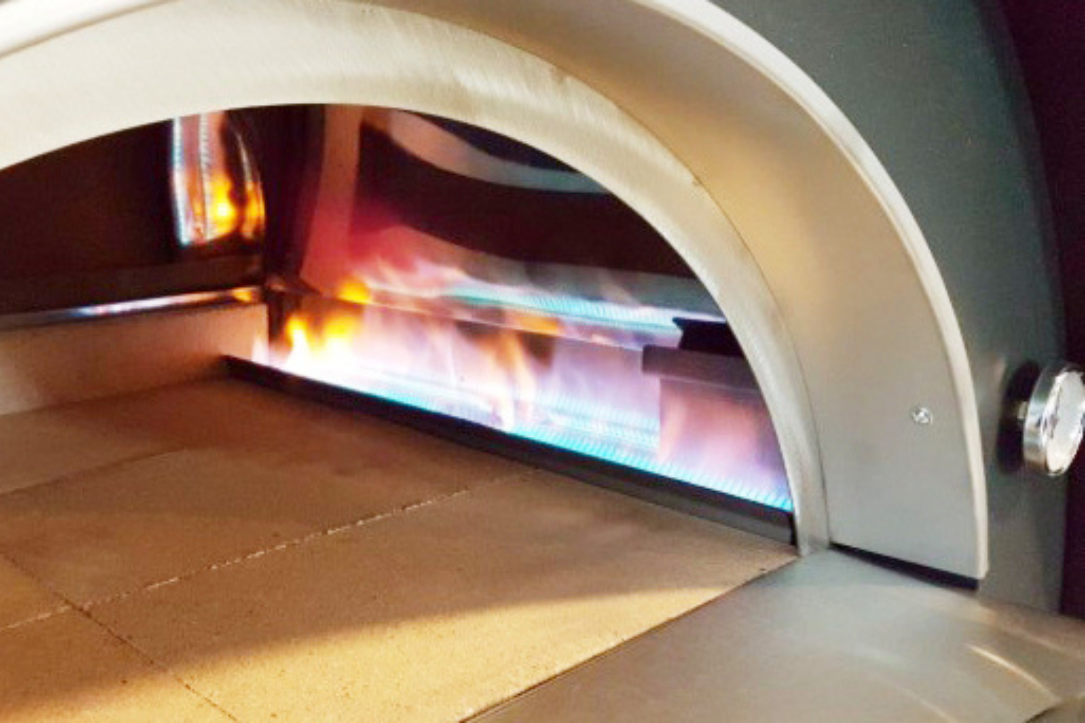 A close up shot of the gas feature within the gas fired pizza oven.