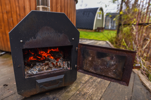 The External Heater of the Fiberglass Hot Tub filled with embers