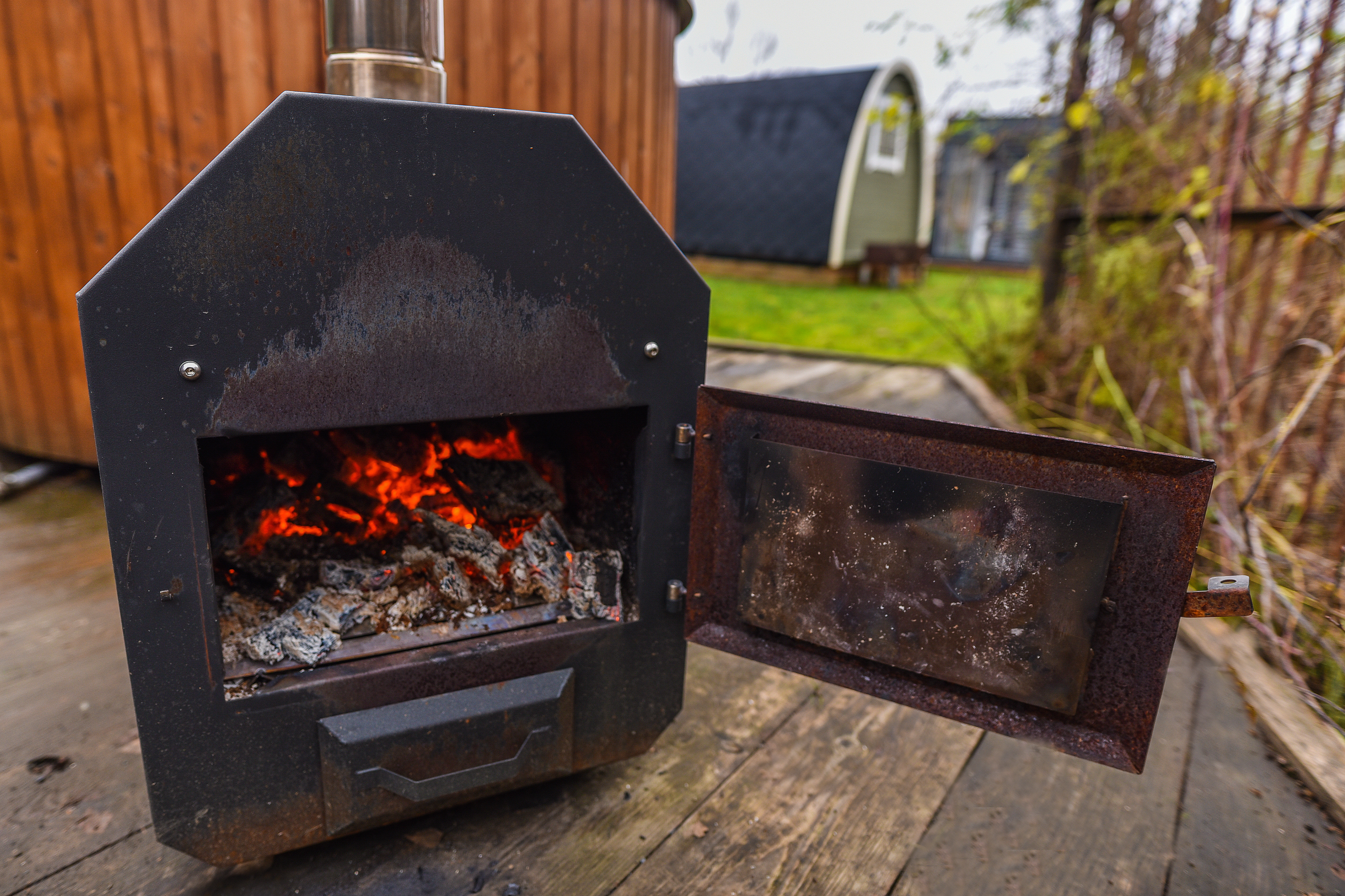 The External Heater of the Fiberglass Hot Tub filled with embers