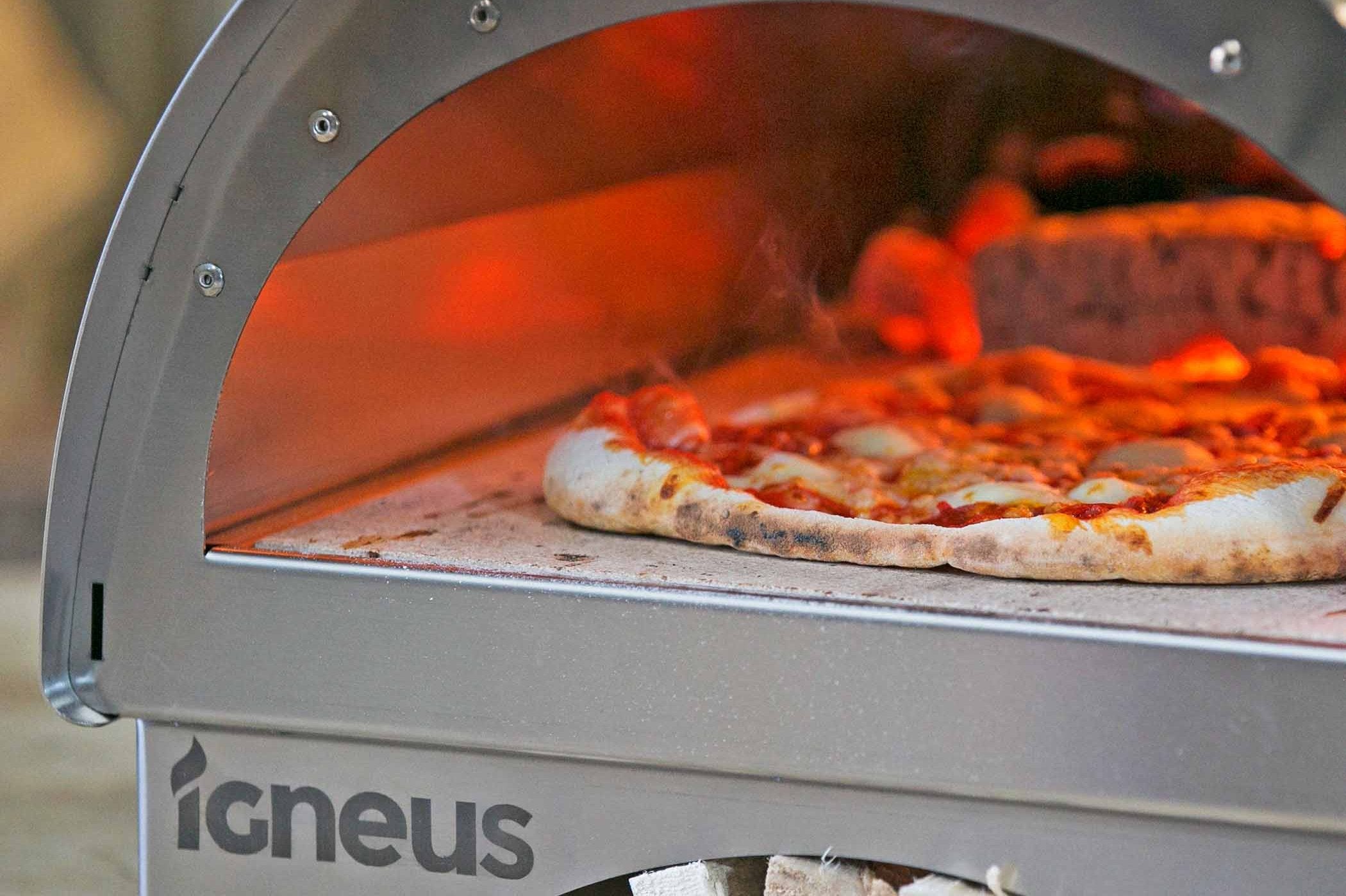 A close up of a homemade pizza. Oven closed and cooking.