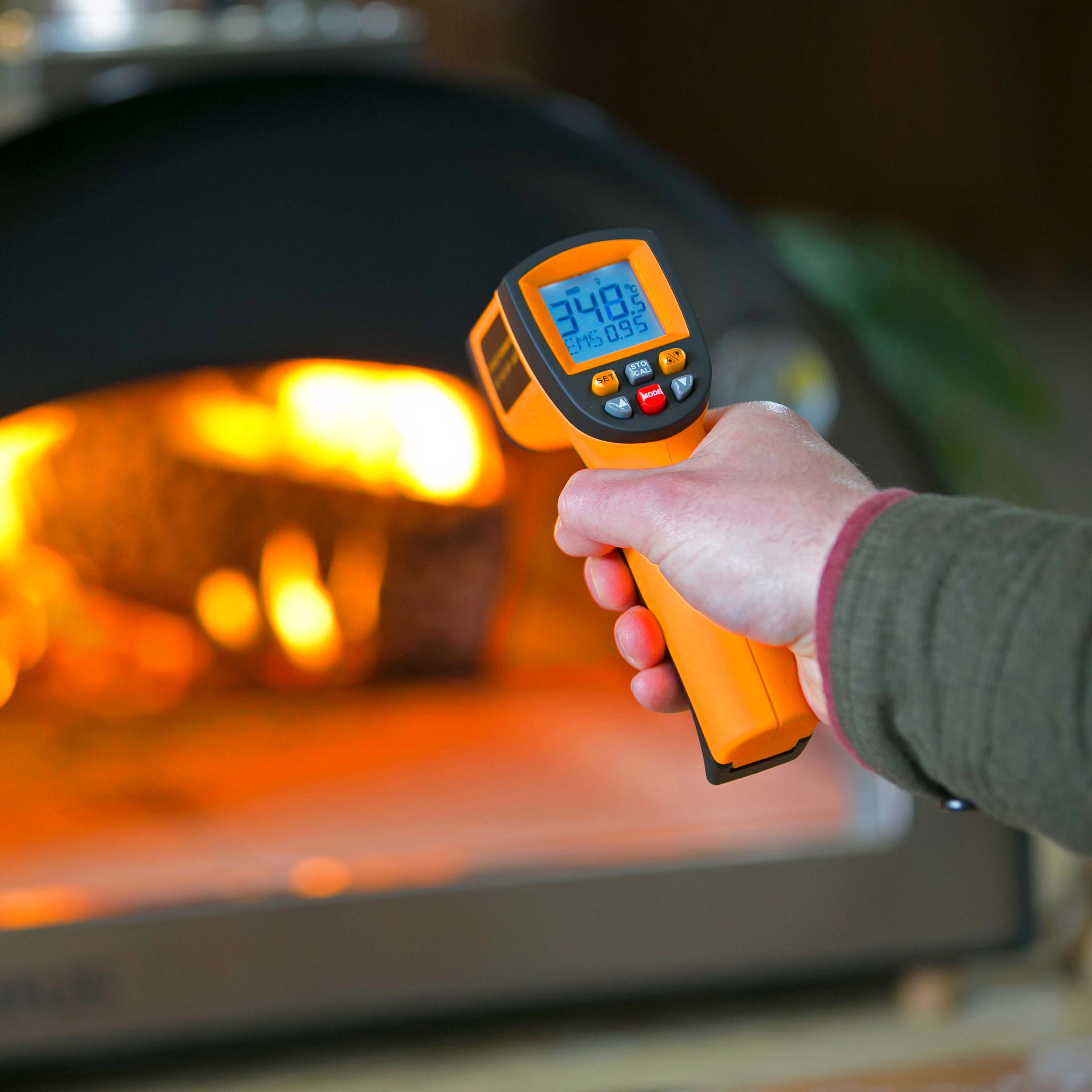 Another close up shot of the digital thermometer in action getting a reading of 340 degrees Celsius from a pizza oven outdoor