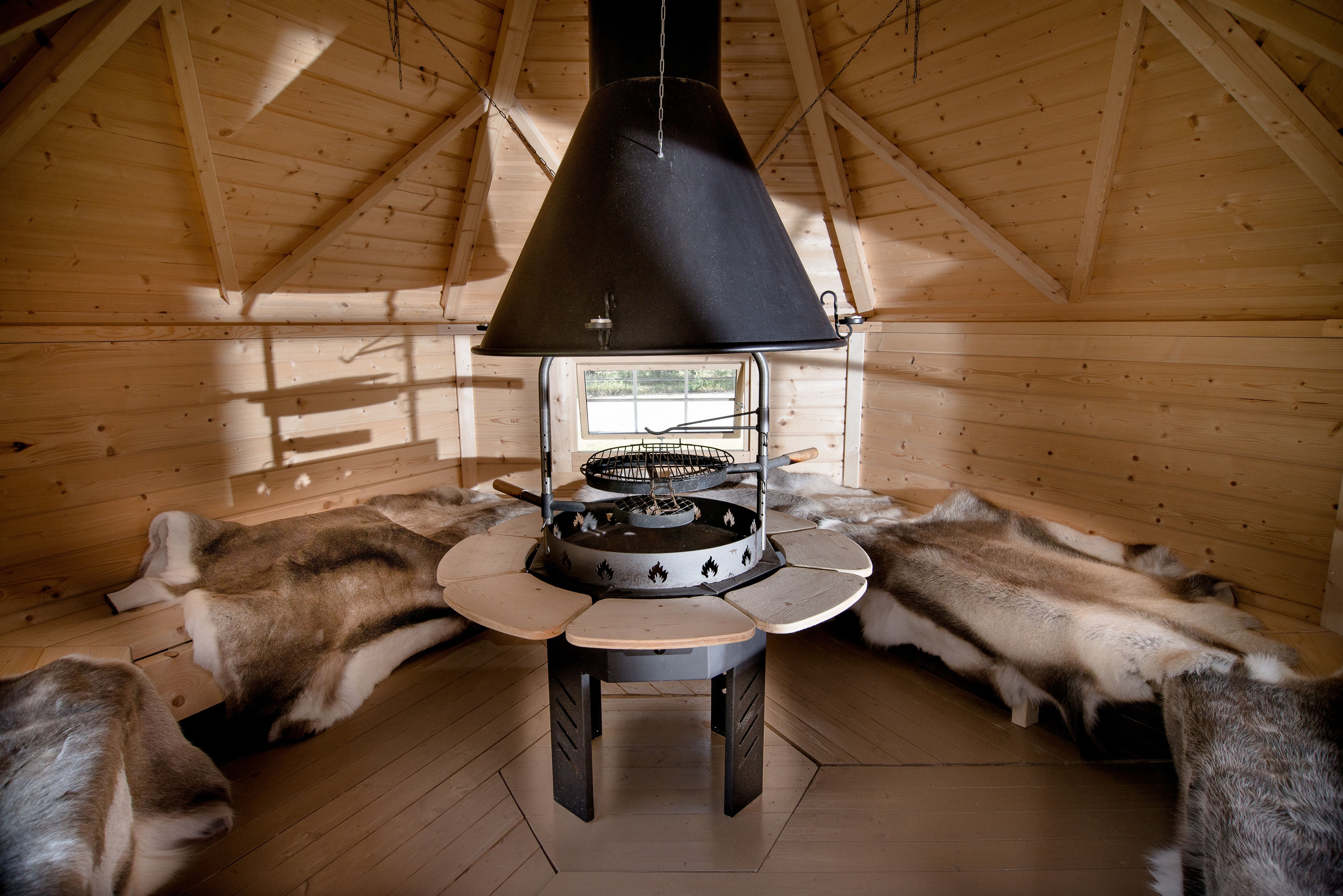 The Viking grill inside a BBQ hut surrounded by Reindeer Hides