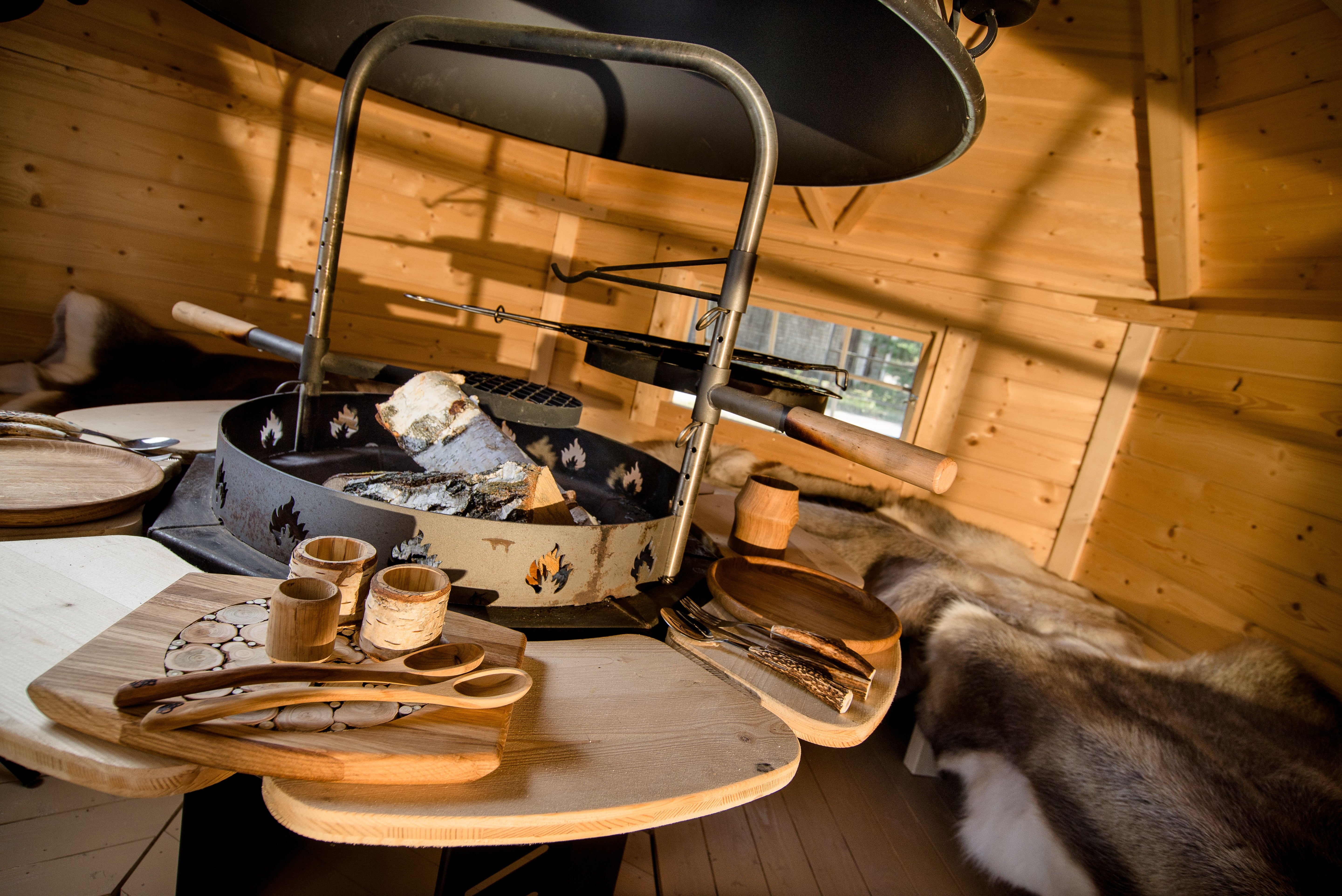 A close up shot of the Viking Grill inside a BBQ Hut with Viking cook and tableware on the benches