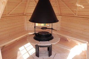 The interior of the BBQ Hut - The BBQ sits in the centre and wooden benches line the walls