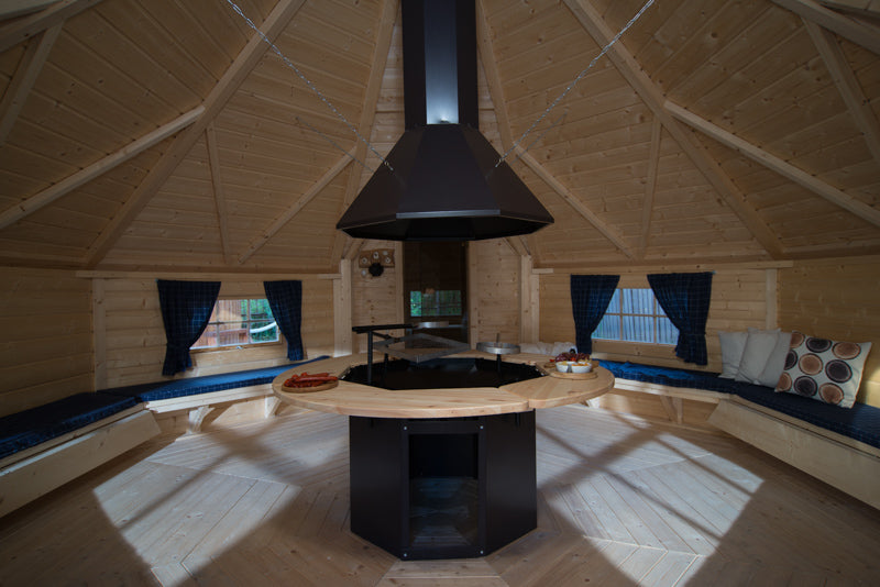 A side profile image of the Grill set up in a grill cabin