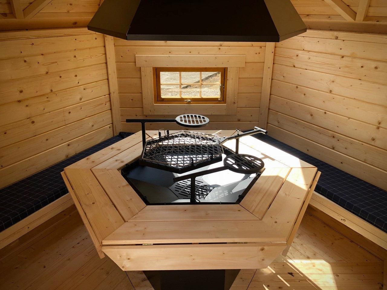 Another interior image showing the BBQ Hut grill set from a different angle with the powder coated grill equipment.