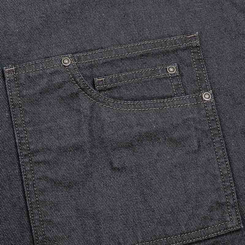 A close up shot of the pocked on the wax look denim apron